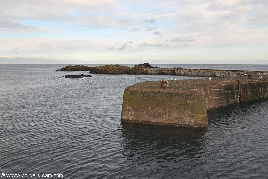 A very calm sea at the harbour entrance.